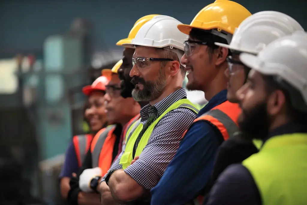 staff at warehouse safety training meeting